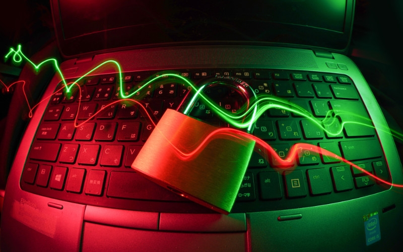 a laptop secured with a padlock, symbolizing data protection and cybersecurity